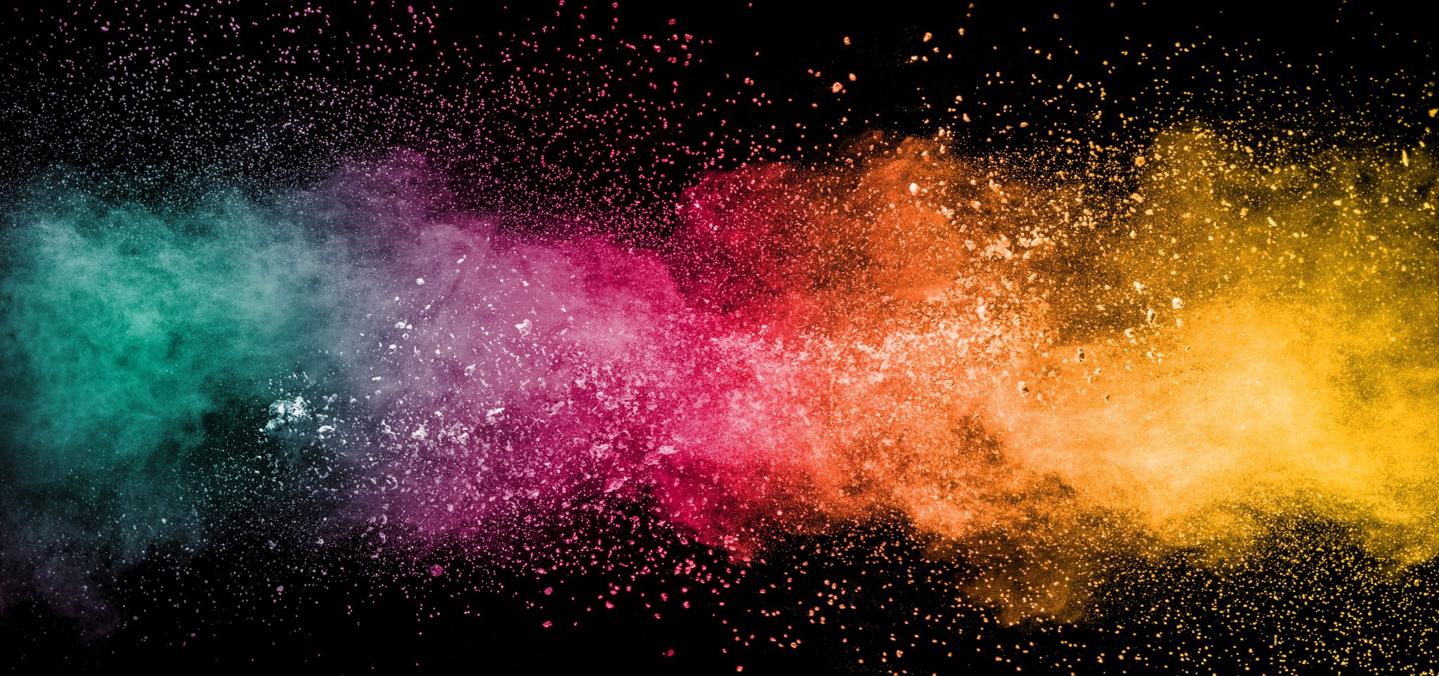Colorful background of pastel powder explosion.Rainbow color dust